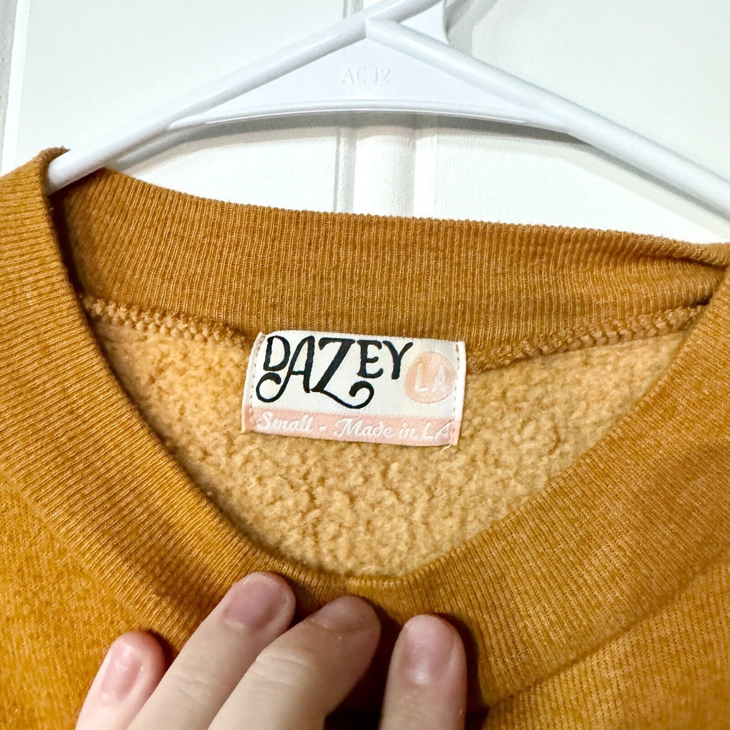 DAZEYLA Sweater Women Size Small Mustard Yellow Crewneck Animal Print Cotton